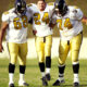 Football player been carried out the football field by team members after severely injuring his ankle.