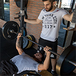 Man lifting weights on bench